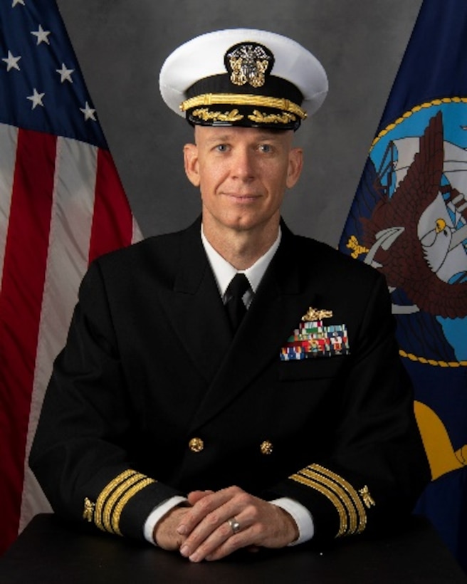 A headshot of a Navy commander