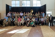 large group of people posing for a group photo.