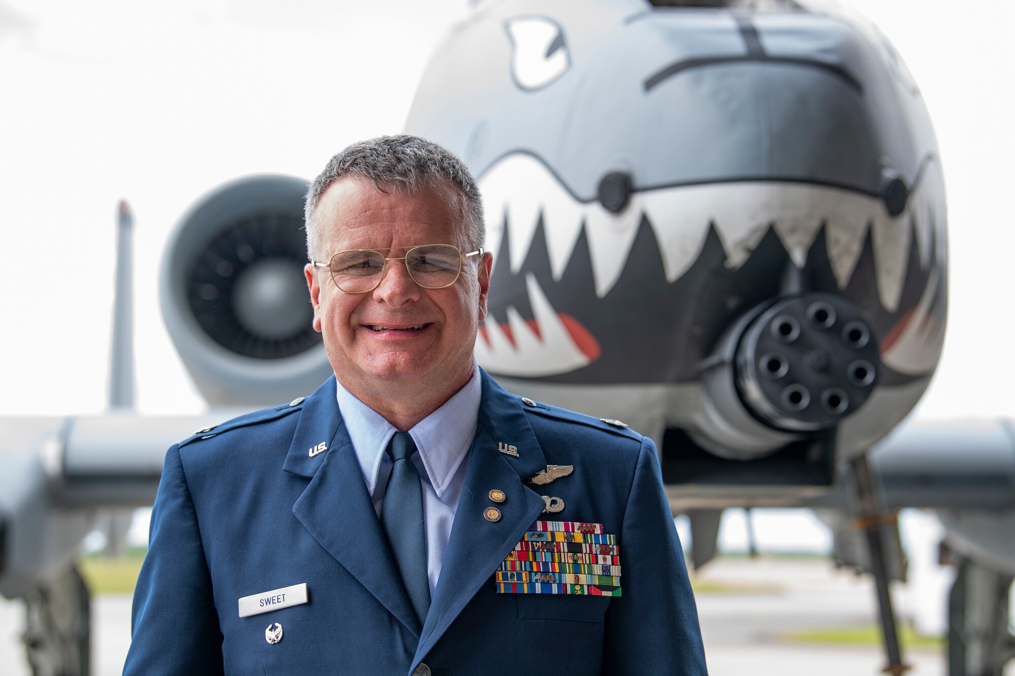 A photo of Lieutenant Colonel Rob Sweet posing in front of an aircraft