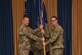 (Left) U.S. Air Force Col. James Clark, 11th Mission Support Group commander, delivers the ceremonial guidon to Lt. Col. Steven Schuldt, 11th Wing Civil Engineer Squadron inbound commander, during the 11th CES change of command ceremony at Joint Base Anacostia-Bolling, June 3, 2021. By accepting the guidon, Schuldt has ceremonially accepted command of the 11th CES. (U.S. Air Force photo by Tech. Sgt. Corey Hook)