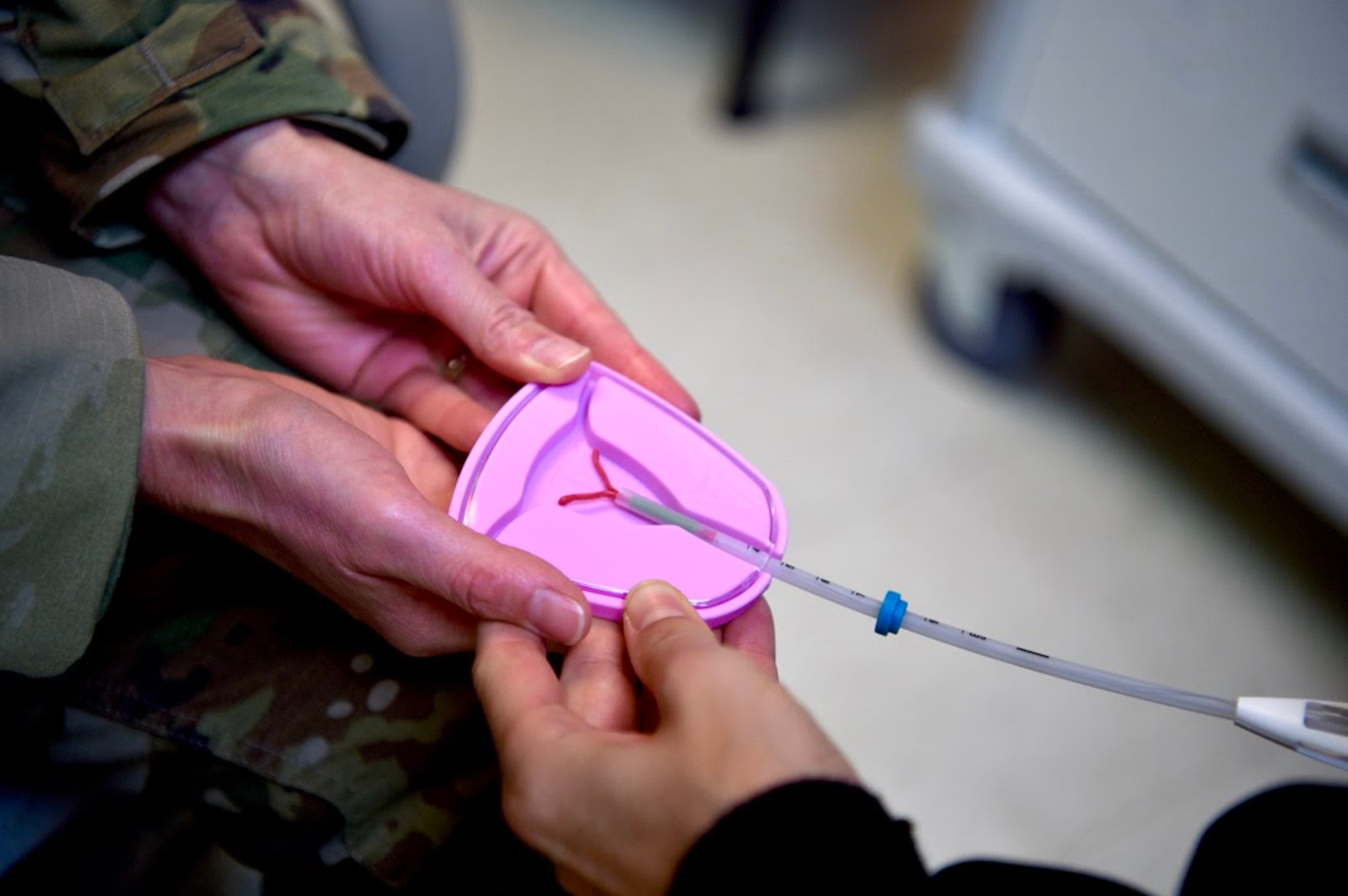 Lt. Col. Paula Neemann, 15th Healthcare Operations Squadron clinical medicine flight commander, demonstrates several birth options, such as an intrauterine device, at the 15th MDG’s contraceptive clinic at Joint Base Pearl Harbor-Hickam, Hawaii, May 6, 2021. The contraceptive clinic opened June 7 to service beneficiaries and provide same-day procedures without a referral. (U.S. Air Force photo by 2nd Lt. Benjamin Aronson)