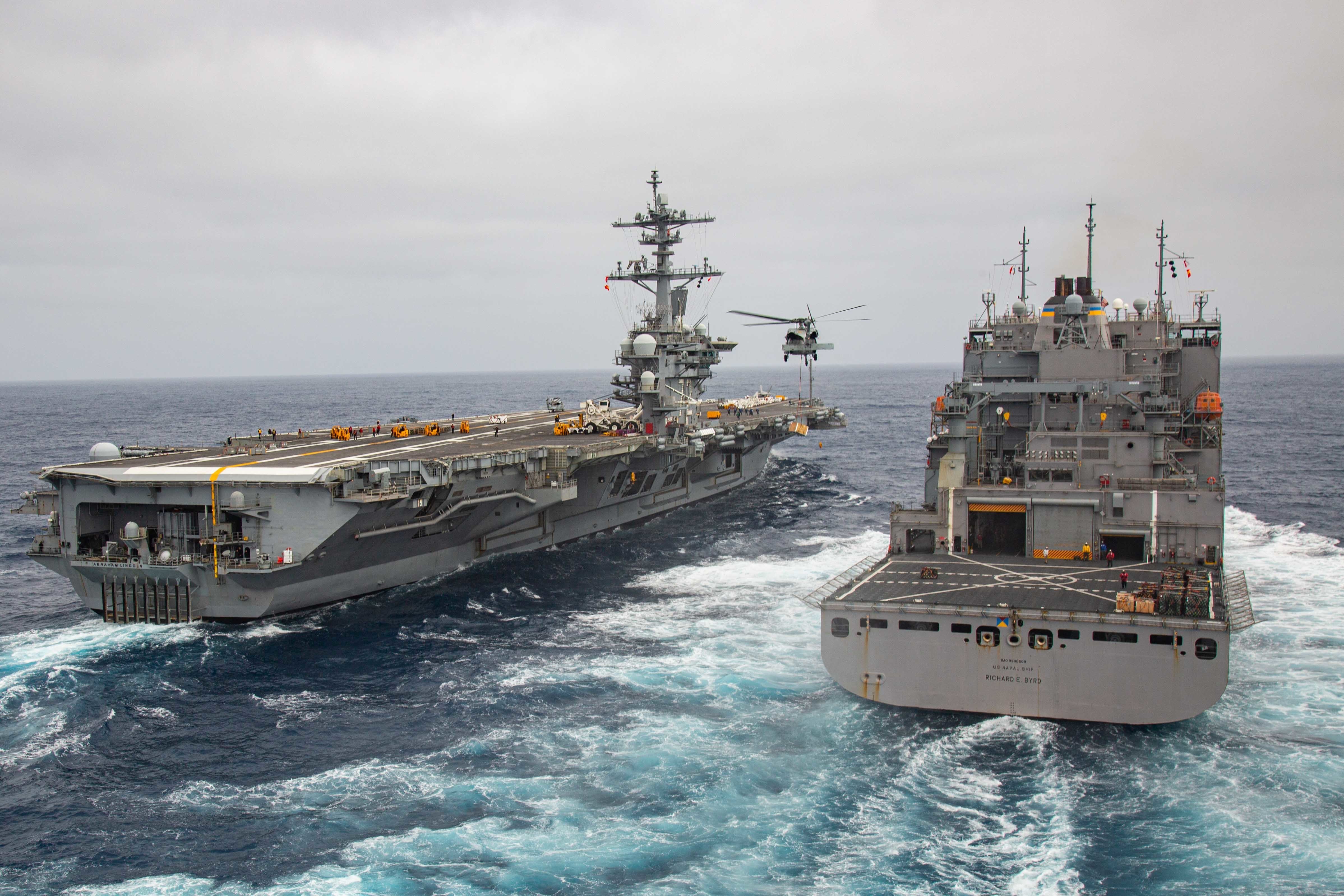 The aircraft carrier USS Abraham Lincoln (CVN 72) steams alongside the dry cargo and ammunition USNS Richard E. Byrd (T-AKE 4).