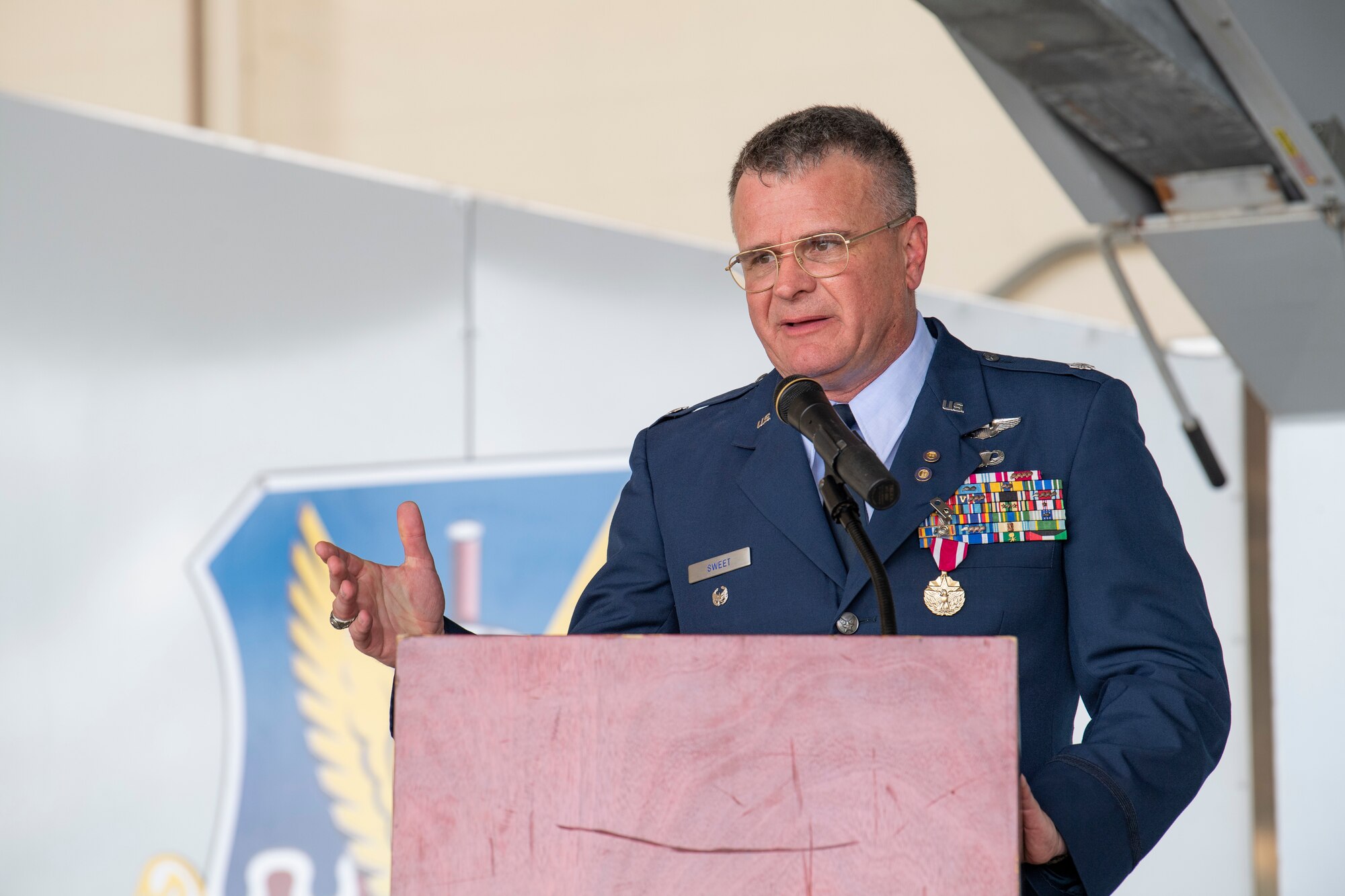 A photo of Lieutenant Colonel Rob Sweet speaking at a podium