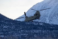 An Alaska Army National Guard Ch-47 Chinook helicopter departs Bryant Army Airfield Dec. 11, 2020