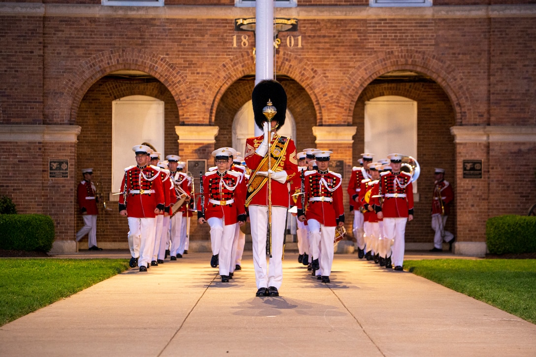 Master GySgt. Duane F. King, drum major, “The President’s Own,” United States Marine Band, leads the band during the Friday Evening Parade at Marine Barracks Washington, June 4, 2021. The guest of honor for the evening was The Honorable Michèle A. Flournoy, 9th Undersecretary of Defense for Policy, and the hosting official for the evening was Lt. Gen. Charles G. Chiarotti, Deputy Commandant for Installations and Logistics. (U.S. Marine Corps photo by Lance Cpl. Tanner D. Lambert)