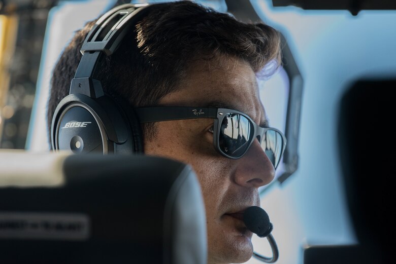 Airman pilot looks out window