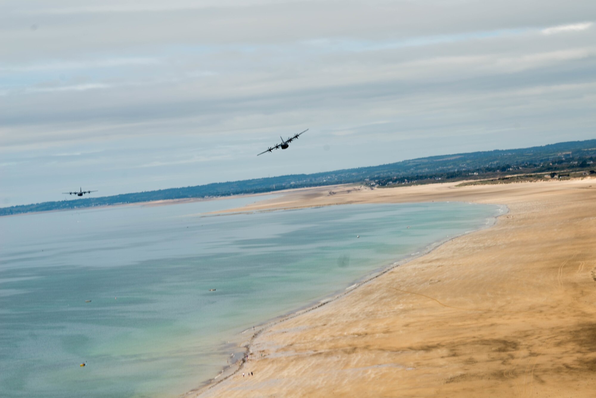 Planes fly over Normandy Beach