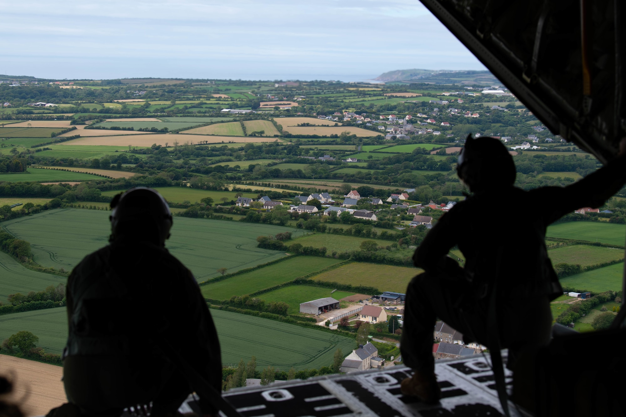 U.S. Air Force Airmen, assigned to Ramstein Air Base, Germany, look from the back of a C-130J Super Hercules aircraft in French airspace on June 6, 2021.