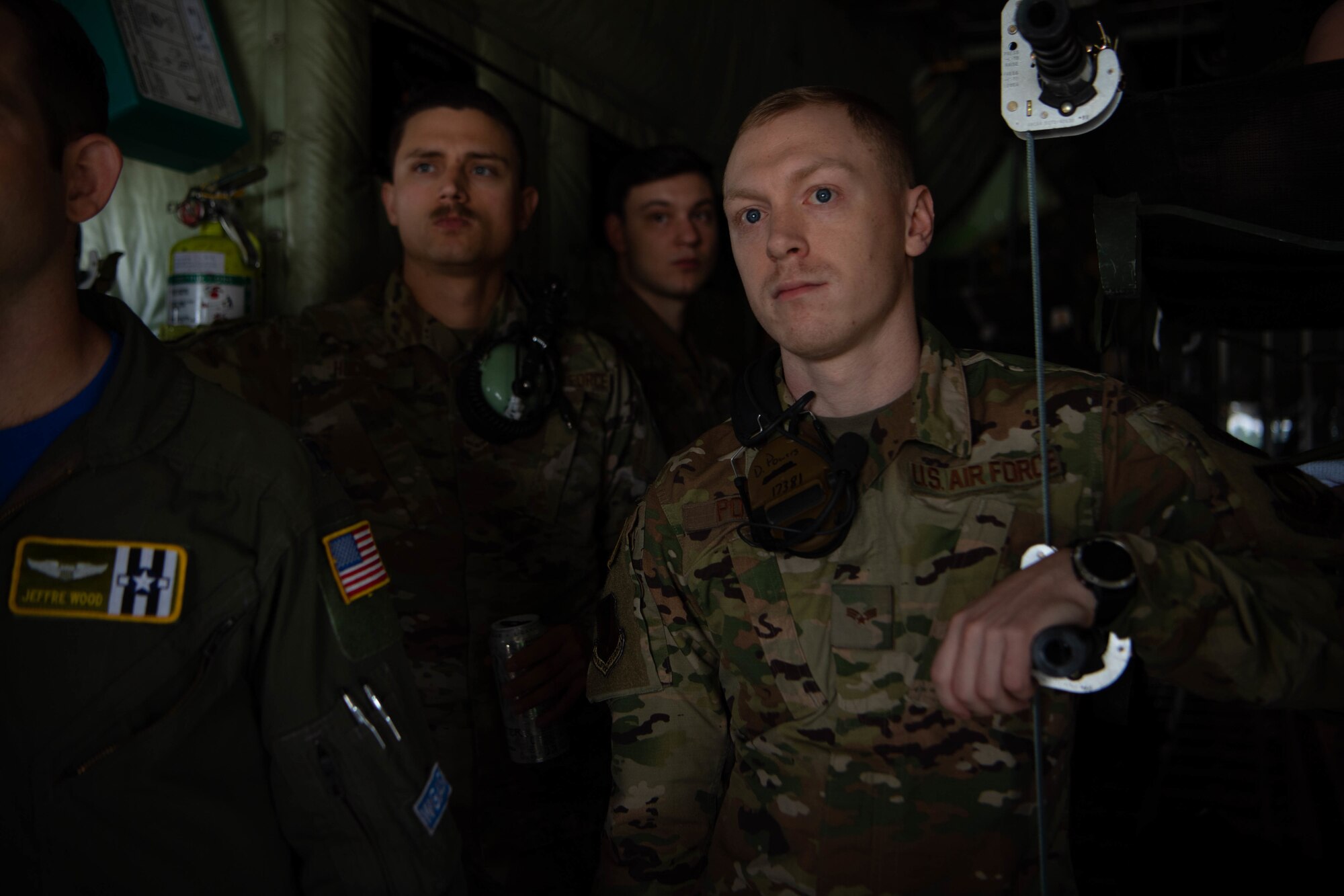 Senior Airman Daniel Powers, 86th Maintenance Group aircraft structural maintainer, listens to a D-Day anniversary pre-flight brief at Ramstein Air Base, Germany, June 6, 2021.