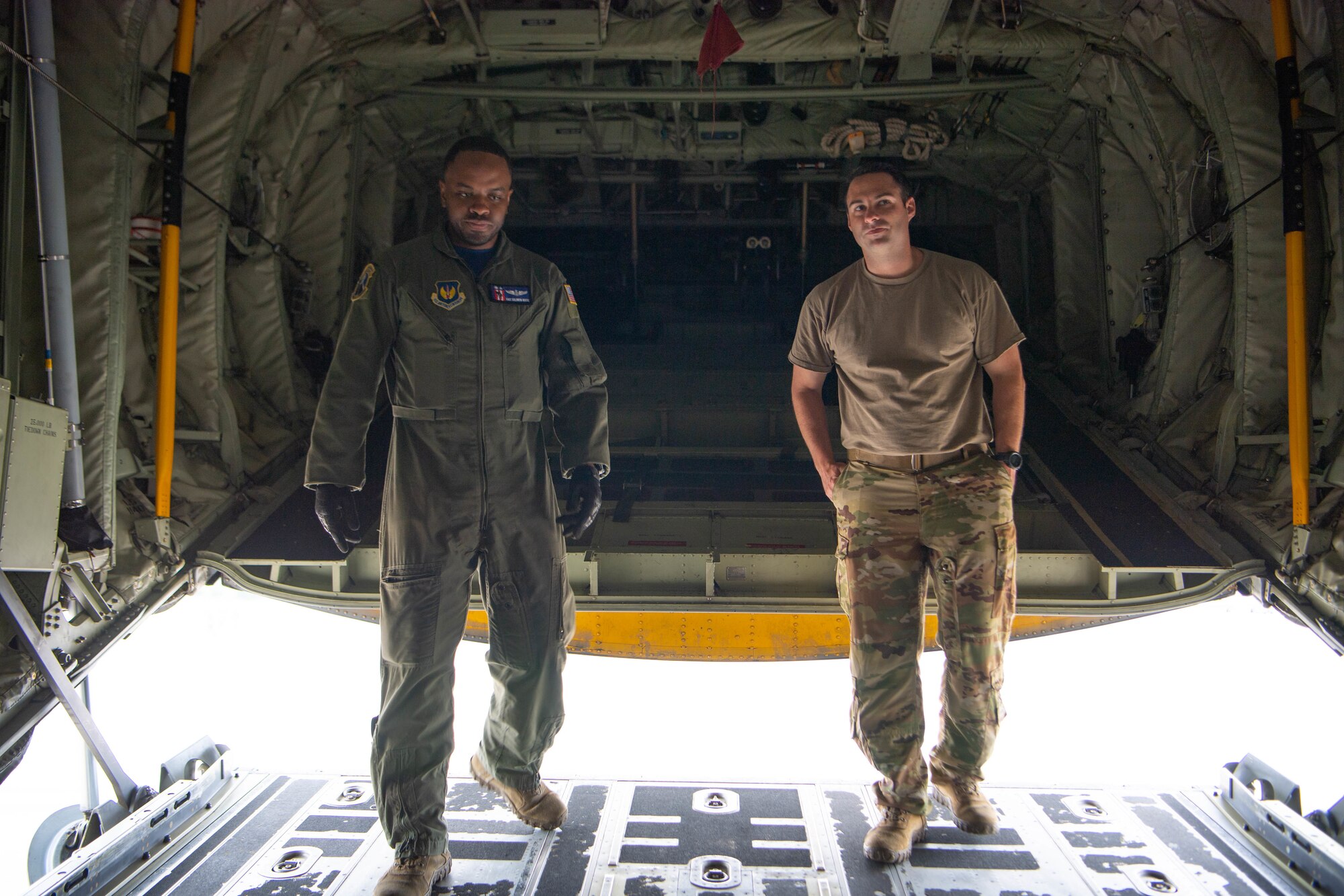 Staff Sgt. Solomon White, 37th Airlift Squadron loadmaster, left, and Maj. Brogan Otoole, 86th Operations Support Squadron chief of tactics, right, close the back of a C-130J Super Hercules aircraft ramp at Ramstein Air Base, Germany, June 6, 2021.