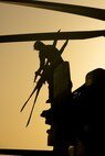 210602-A-UN662-1652 NAVAL SUPPORT ACTIVITY BAHRAIN (June 2, 2021) – Lt. Peter Fulton, assigned to Helicopter Sea Combat Squadron (HSC) 26, conducts pre-flight maintenance on an MH-60S Sea Hawk helicopter onboard Naval Support Activity Bahrain, June 2. HSC-26 is deployed to the U.S. 5th Fleet area of operations in support of naval operations to ensure maritime stability and security in the Central Region, connecting the Mediterranean and Pacific through the western Indian Ocean and three critical chokepoints to the free flow of global commerce. (U.S. Army photo by Sgt. Wheeler Brunschmid)