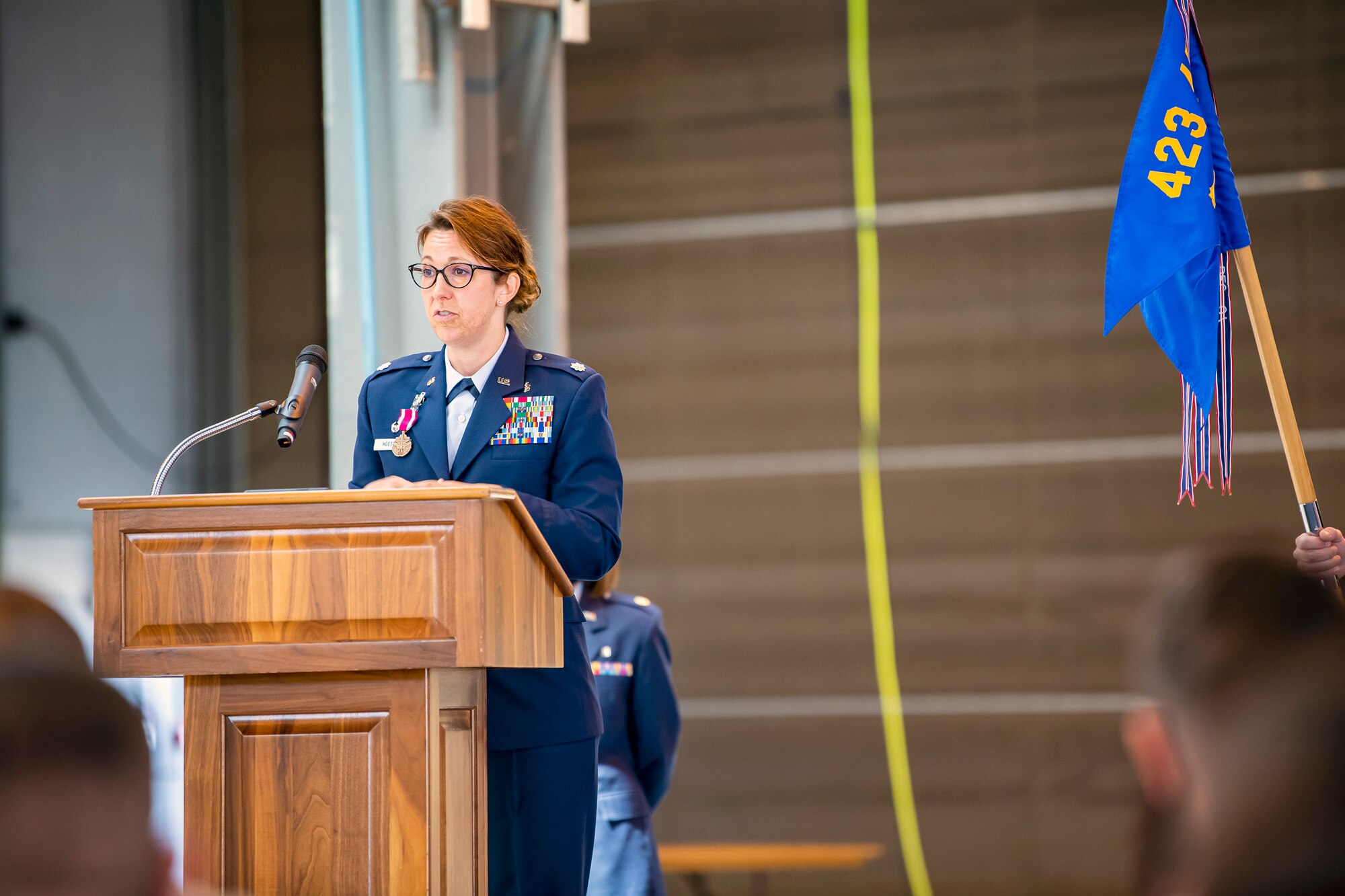 U.S. Air Force Lt. Col. Elizabeth Hoettels, 423rd Medical Squadron outgoing commander, speaks during a change of command ceremony at RAF Alconbury, England, June 7, 2021. During the ceremony Hoettels relinquished command of the 423rd MDS to Lt. Col. Darrell Lee. (U.S. Air Force photo by Senior Airman Eugene Oliver)