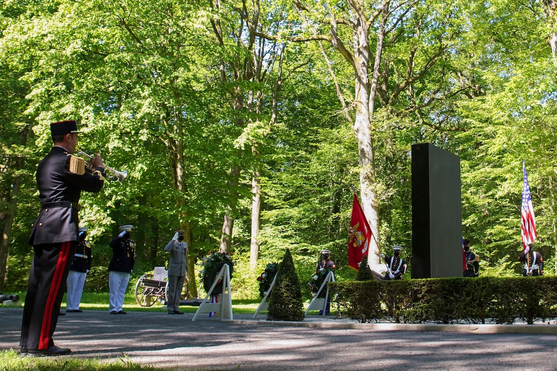 A French bugler plays taps during a wreath laying ceremony at the Iron Mike statue near Belleau, France, May 30, 2021. The ceremony was held Memorial Day weekend in commemoration of the 103rd anniversary of the battle of Belleau Wood, conducted to honor the legacy of service members who gave their lives in defense of the United States and European allies. (U.S. Marine Corps photo by Staff Sgt. Brytani Musick)