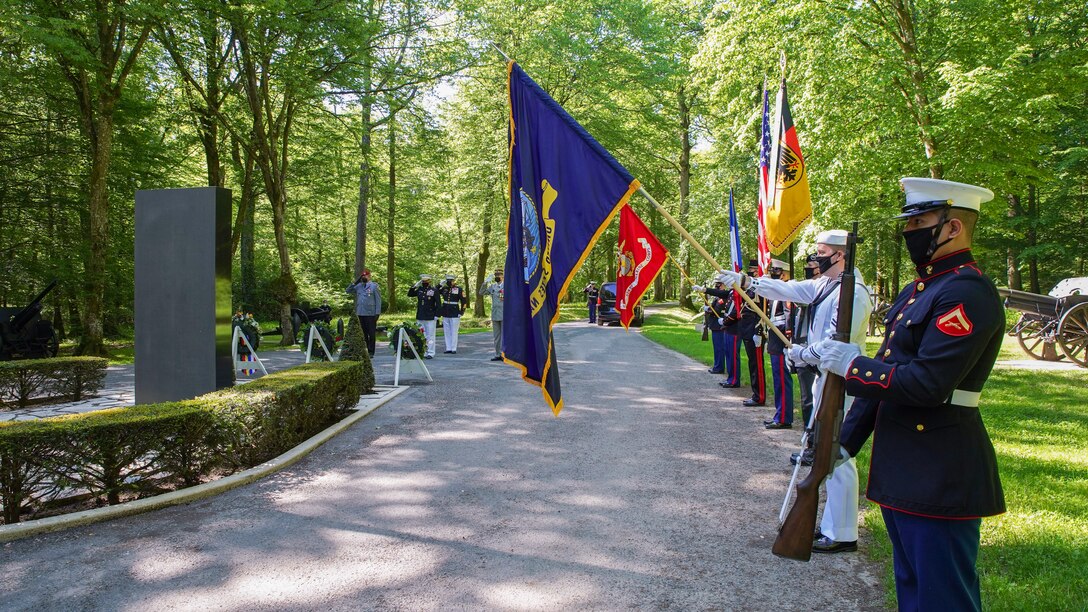 A joint color guard presents the colors during the U.S. National Anthem during a ceremony at the Iron Mike statue near Belleau, France, May 30, 2021. The ceremony was held Memorial Day weekend in commemoration of the 103rd anniversary of the battle of Belleau Wood, conducted to honor the legacy of service members who gave their lives in defense of the United States and European allies. (U.S. Marine Corps photo by Staff Sgt. Brytani Musick)