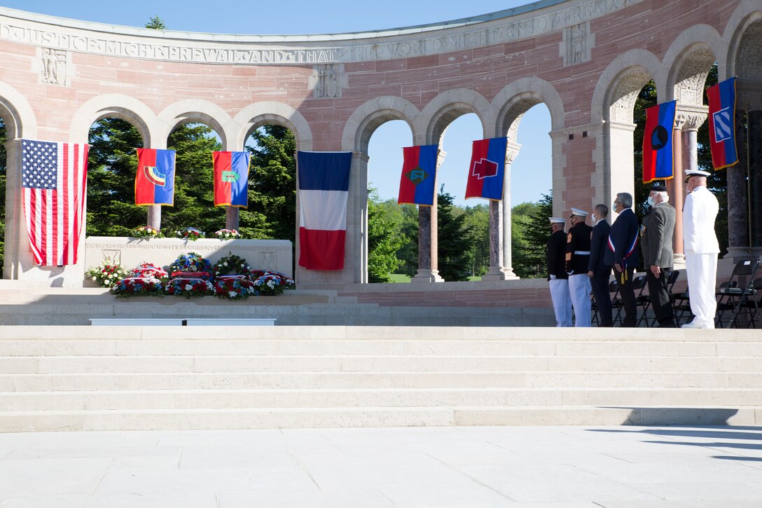 Particpants render honors for the playing of taps during a ceremony at the Oise-Aisne American Cemetery near Seringes-et-Nesles, France, May 30, 2021. The ceremony was held Memorial Day weekend in commemoration of the 103rd anniversary of the battle of Belleau Wood, conducted to honor the legacy of service members who gave their lives in defense of the United States and European allies. This was the first time since the battle over a century ago that U.S. Marine Corps, U.S. Army, U.S. Navy, French, and German service members were all present for the ceremonies. (U.S. Marine Corps photo by Staff Sgt. Brytani Musick)