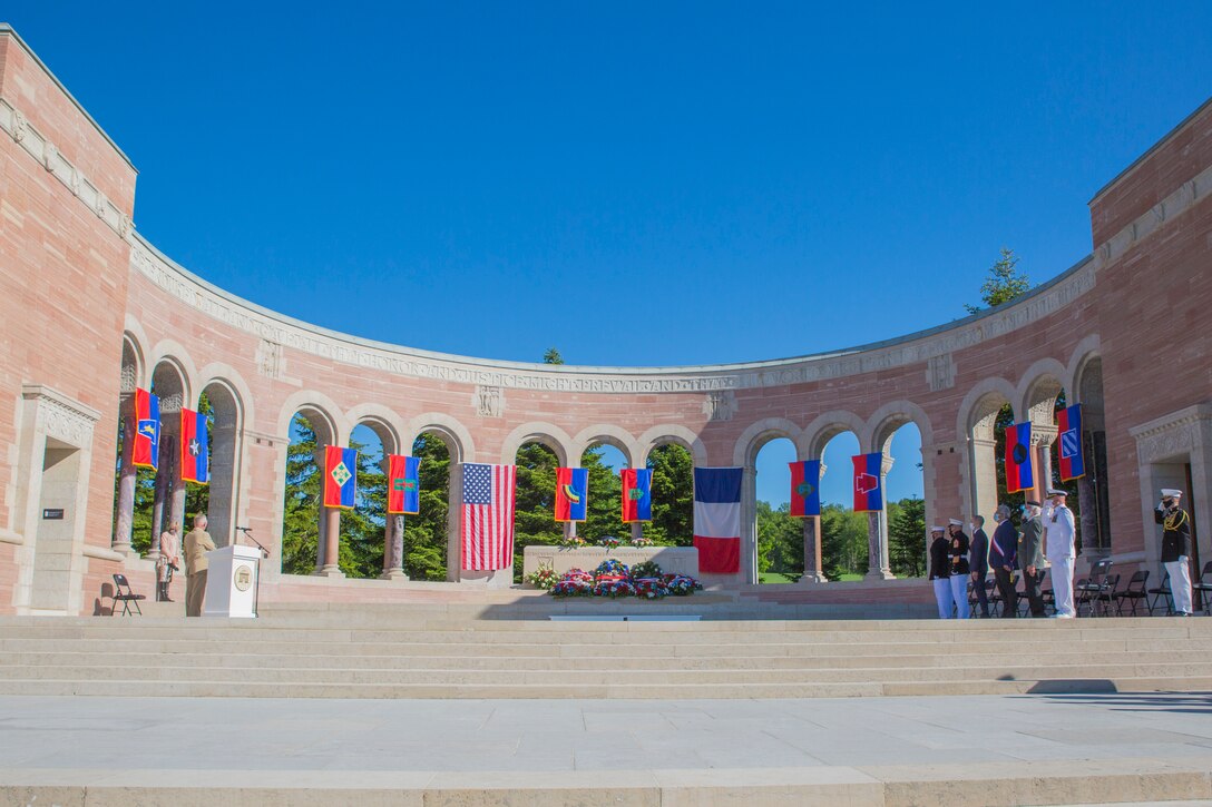 Participants render honors for the playing of taps during a ceremony at the Oise-Aisne American Cemetery near Seringes-et-Nesles, France, May 30, 2021. The ceremony was held Memorial Day weekend in commemoration of the 103rd anniversary of the battle of Belleau Wood, conducted to honor the legacy of service members who gave their lives in defense of the United States and European allies. This was the first time since the battle over a century ago that U.S. Marine Corps, U.S. Army, U.S. Navy, French, and German service members were all present for the ceremonies. (U.S. Marine Corps photo by Staff Sgt. Brytani Musick)