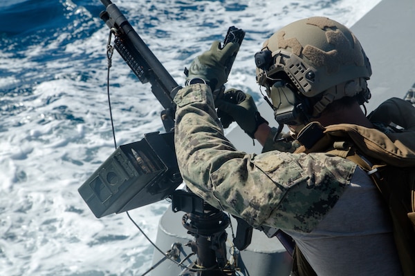 210602-A-MU580-1215 ARABIAN GULF (June 2, 2021) – A Sailor assigned to Commander, Task Force (CTF) 56 participates in a live-fire exercise as part of an air operations in support of maritime surface warfare (AOMSW) exercise in the Arabian Gulf, June 2. CTF 56 commands and controls the employment of tactical Navy expeditionary combat forces in order to maximize U.S. 5th Fleet’s lethality throughout the maritime domain utilizing eight task groups whose missions range from explosive ordnance disposal and salvage diving, Army civil affairs, Naval construction forces and expeditionary logistics support, maritime interdiction operations and maritime security, and embarked security teams. (U.S. Army photo by Spc. Zion Thomas)