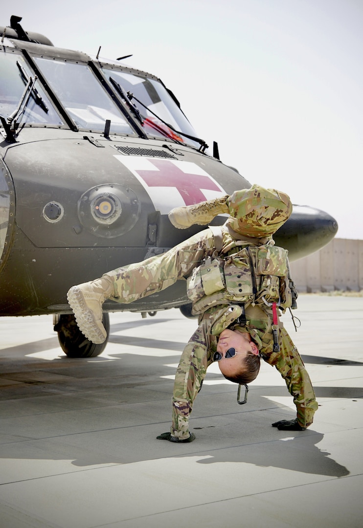 Staff Sgt. Brianna Pritchard, an Army National Guard UH-60 Black Hawk helicopter mechanic from Anchorage, Alaska, shows her Olympic breaking moves at Al Asad Air Base, Iraq, in May 2021. Pritchard is training to qualify for the 2024 Paris Olympics.