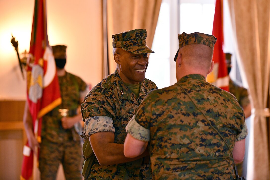 U.S. Marine Corps Maj. Gen. Michael E. Langley, the outgoing commander of U.S. Marine Corps Forces, Europe and Africa (MARFOREUR/AF), prepares to address the command as outgoing commander during the MARFOREUR/AF change of command ceremony at the U.S. Army Garrison Stuttgart firehouse in Boeblingen, Germany, May 6, 2021. This ceremony recognizes the significance of the passage of command, honors the accomplishments of the organization under the outgoing commander, and formally appoints the incoming commander. (U.S. Army Photo by Jason Johnston)