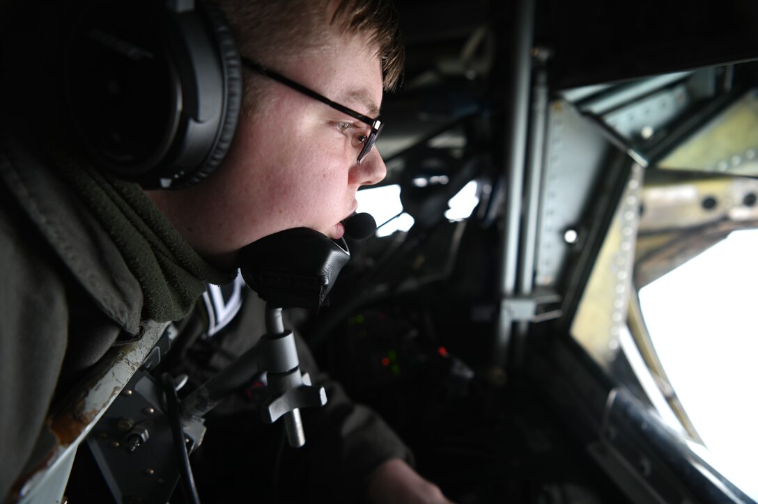 U.S. Air Force Airman 1st Class Shawn Parzych, 351st Air Refueling Squadron boom operator, lowers the boom prior to a flyover at Omaha Beach, France, June 4, 2021. The flyover was part of a ceremony to honor Charles Norman Shay, who served as a medical technician in the first wave attack on the beach. (U.S. Air Force photo by Staff Sgt. Matthew J. Wisher)
