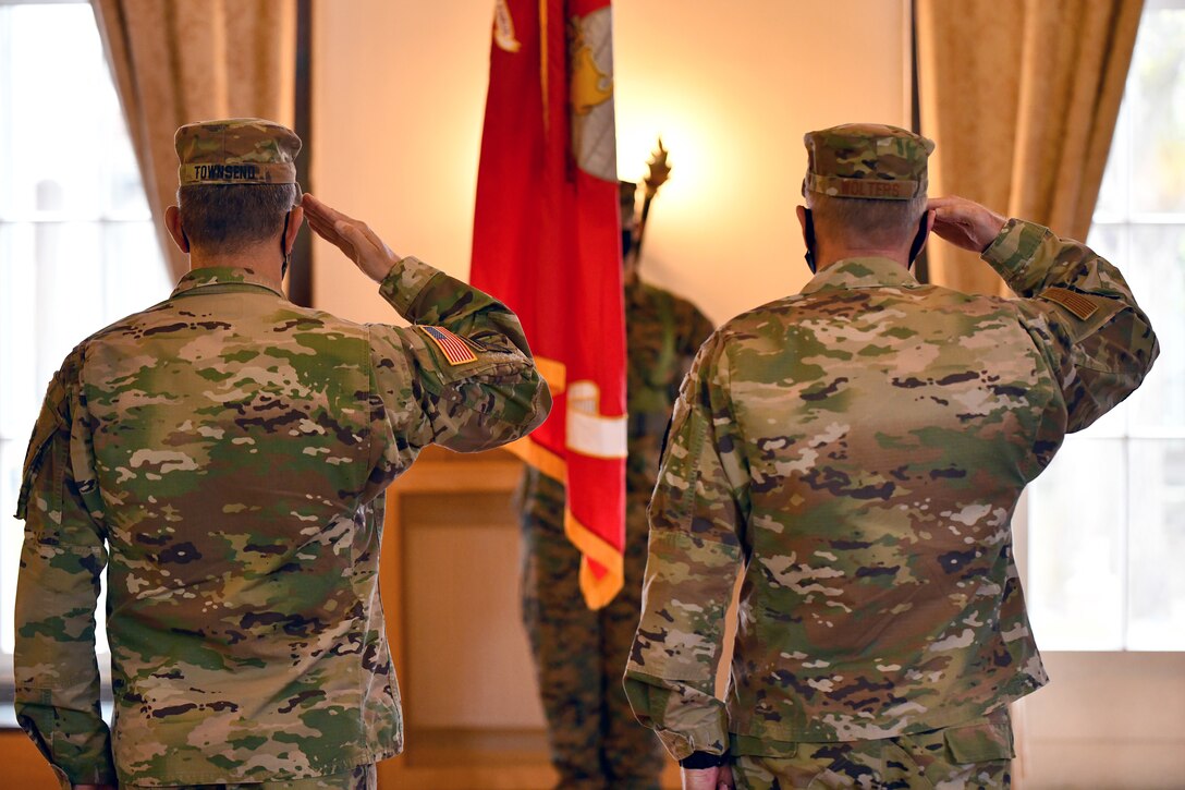 U.S. Army Gen. Stephen F. Townsend, left, commander of U.S. Africa Command, and Gen. Tod D. Wolters, right, commander of U.S. European Command, salute during the playing of the National Anthem during the U.S. Marine Corps Forces, Europe and Africa change of command ceremony at the U.S. Army Garrison Stuttgart firehouse in Boeblingen, Germany, May 6, 2021. This ceremony recognizes the significance of the passage of command, honors the accomplishments of the organization under the outgoing commander, and formally appoints the incoming commander. (U.S. Army Photo by Jason Johnston)