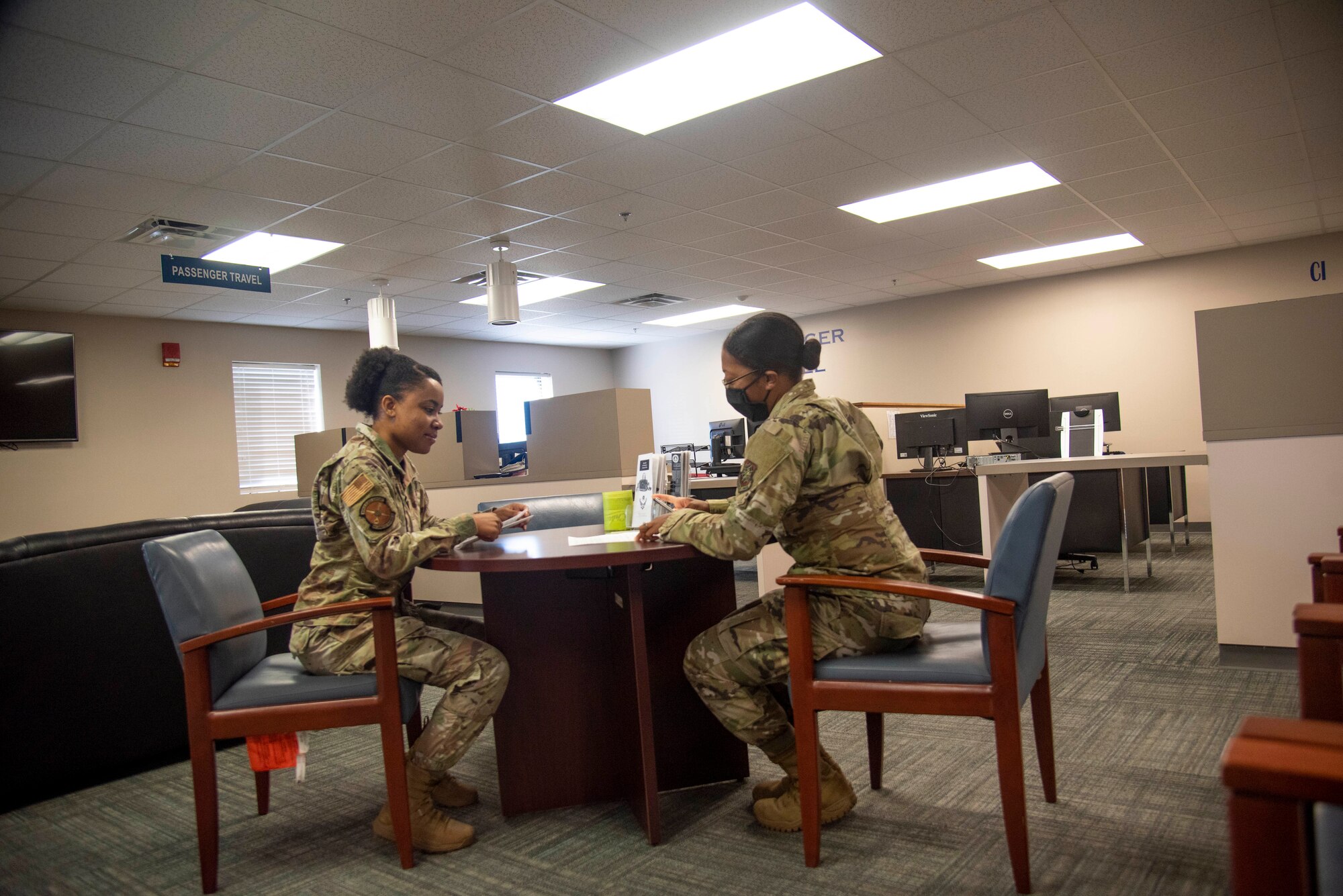 U.S. Air Force Senior Airman Quamashae Riggins, 6th Logistics Readiness Squadron (LRS) Cargo Movement Specialist, briefs an Airman on the 6th LRS Travel Management Office’s personal property processes at MacDill Air Force Base, Florida, May 26, 2021. The 6th LRS TMO personal property section works with the largest area of responsibility in Florida with their peak business season being in the summer months when most permanent change of stations of occur within the military.