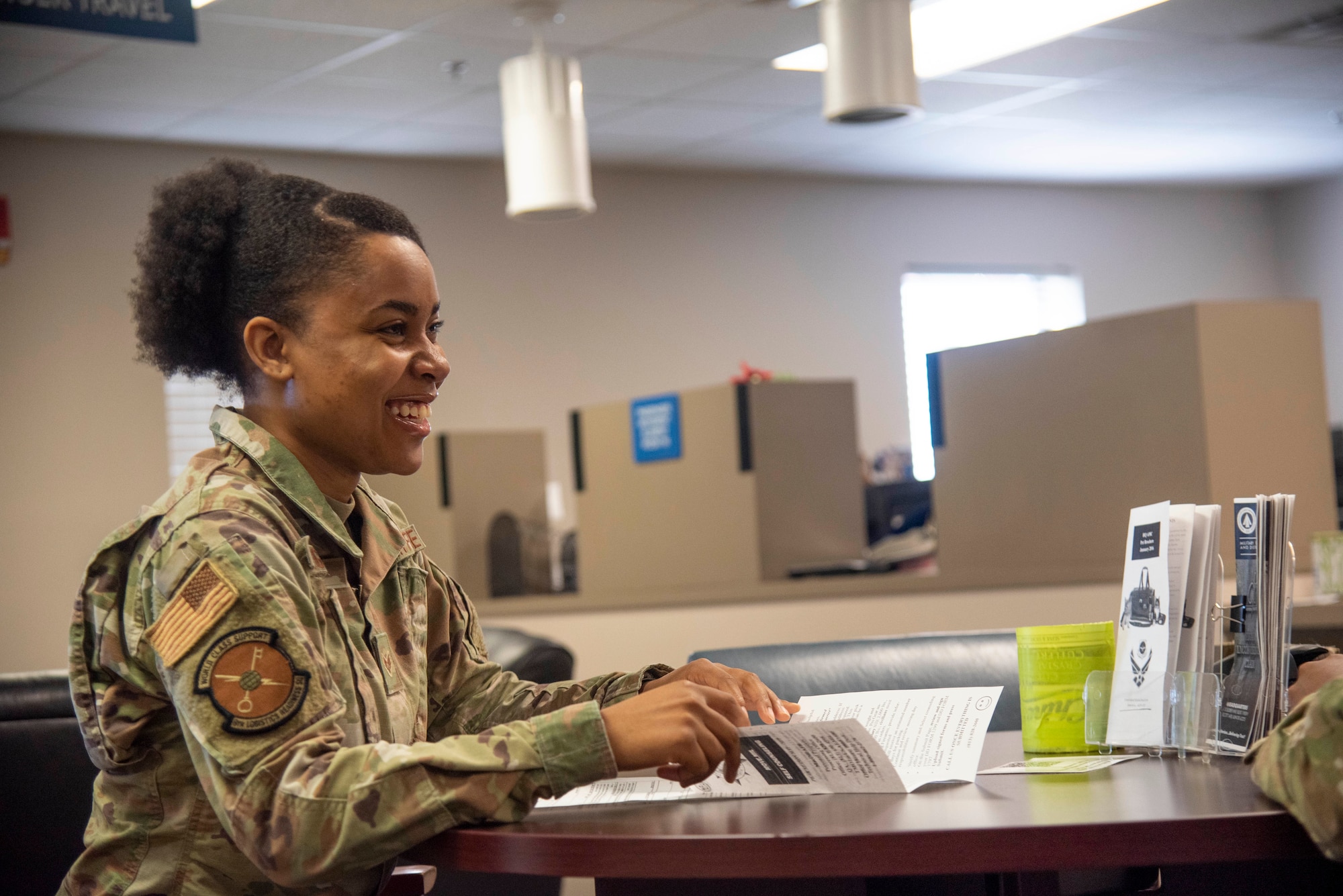 U.S. Air Force Senior Airman Quamashae Riggins, 6th Logistics Readiness Squadron (LRS) Cargo Movement Specialist, briefs an Airman on the 6th LRS Travel Management Office’s personal property processes at MacDill Air Force Base, Florida, May 26, 2021. Any military member who is retiring, separating or changing duty stations will work with TMO, specifically personal property and passenger travel, to get their personal belongings shipped to their next home.