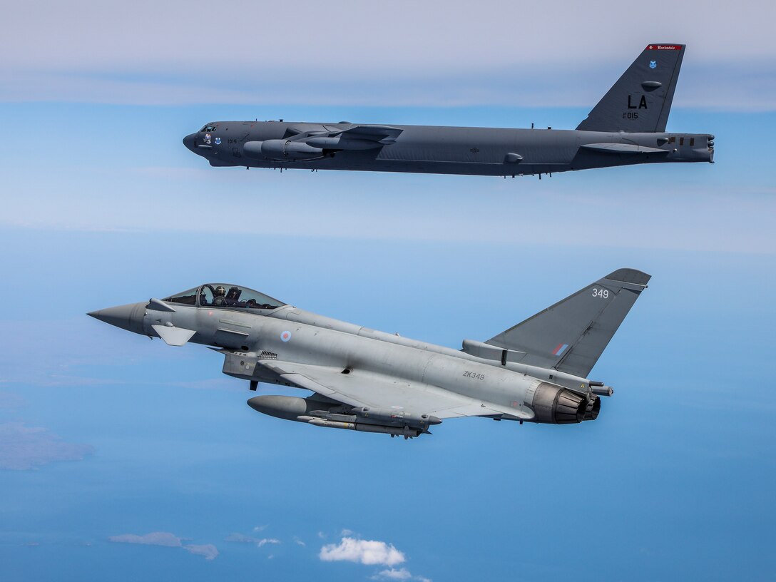 A B-52H Stratofortress operating out of Morón Air Base, Spain, flies alongside a Royal Air Force Eurofighter Typhoon during the Bomber Task Force Europe mission Allied Sky, May 31, 2021. Forward locations in Europe enable the U.S. Air Force to live, train, and fight with allies and partners. (Courtesy photo by the Royal Air Force)