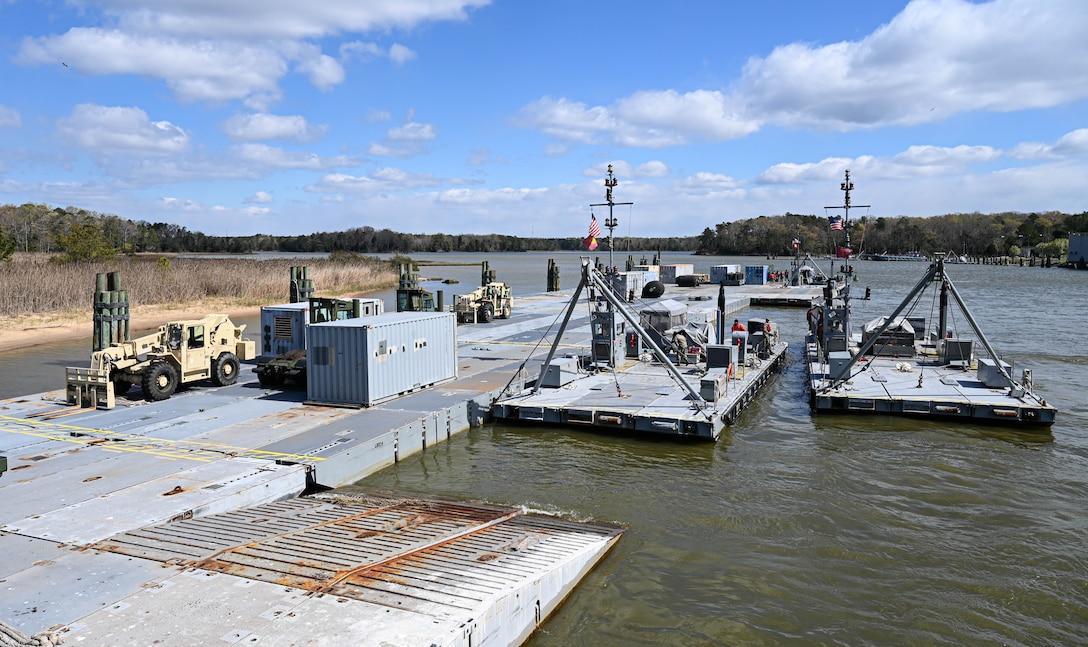 U.S. Soldiers from the 7th Transportation Brigade (Expeditionary) load and secure supplies and equipment at 3rd Port, Joint Base Langley-Eustis, Virginia, April 2, 2021. Soldiers secured the equipment so it could be safely transported to an exercise. (U.S. Air Force photo by Senior Airman Sarah Dowe)