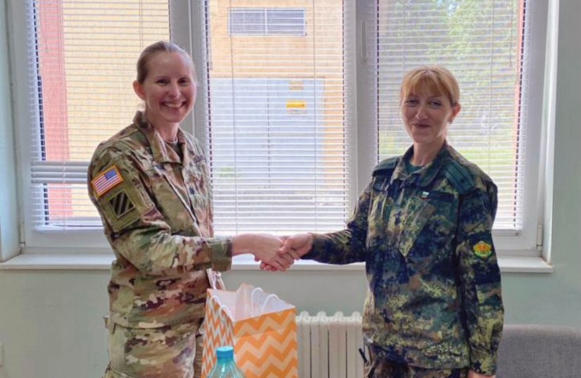 U.S. Army Reserve Lt. Col. Mary J. Durham, commander of the 773rd Civil Support Team, 7th Mission Support Command, left, shakes hands with Bulgarian Army Maj. Natalya Ivanova, commander of the 38th Chemical, Biological, Radiological, Nuclear Defence Battalion during a military-to-military exchange held in Sofia, Bulgaria, May 25-28, 2021. The event was designed to enhance relationships and interoperability with Allies and partner nations. (U.S. Army Reserve photo by Staff Sgt. Rosannie Murillo, 773rd CST)