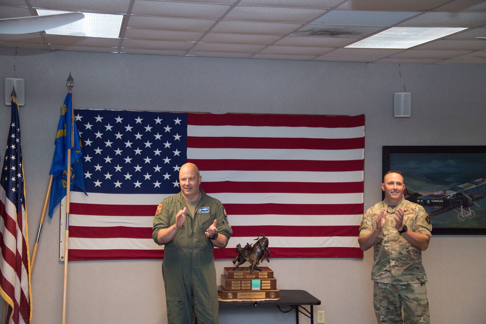 Maj. Gen. Brian Borgen, Tenth Air Force Commander and Chief Master Sgt. Jeremy Malcom, Tenth Air Force Command Chief, announce the winner of the Power and Vigilance Award