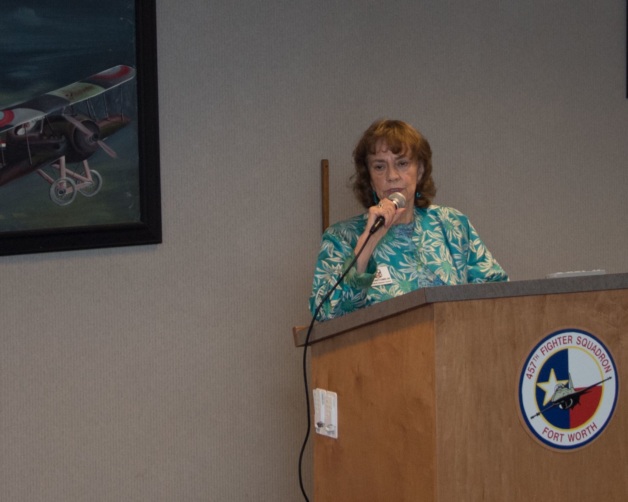 Ms. Maritta Sumner, Fort Worth Air Power Council Board Chair, speaks about the history of the Tenth Air Force Power and Vigilance Award. The award is presented to the Tenth Air Force unit which best exhibits the Numbered Air Force's vision as "The premier provider of affordable, integrated, flexible and mission-ready Reserve Citizen Airmen to execute power and vigilance in support of U.S. National Security."