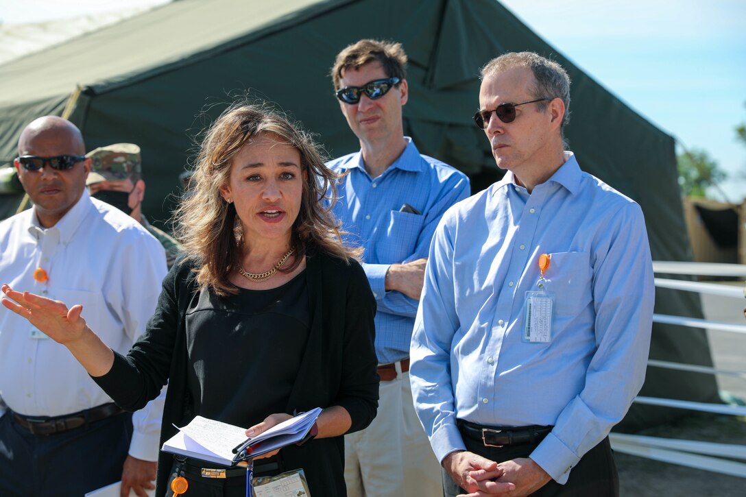 Karna Cohen, an exercise support contractor, briefs the concerns of the United Nations during the Rehearsal of Concept drill at Command Post Exercise – Functional (CPX-F) 21-02 at Ft. McCoy, Wis., June 5, 2021. As a contracted role player, Cohen succinctly briefs the refugee situation and can request detailed coordination for supplies and communication lending a realism to the exercise that troops are seldom able to replicate at home station.