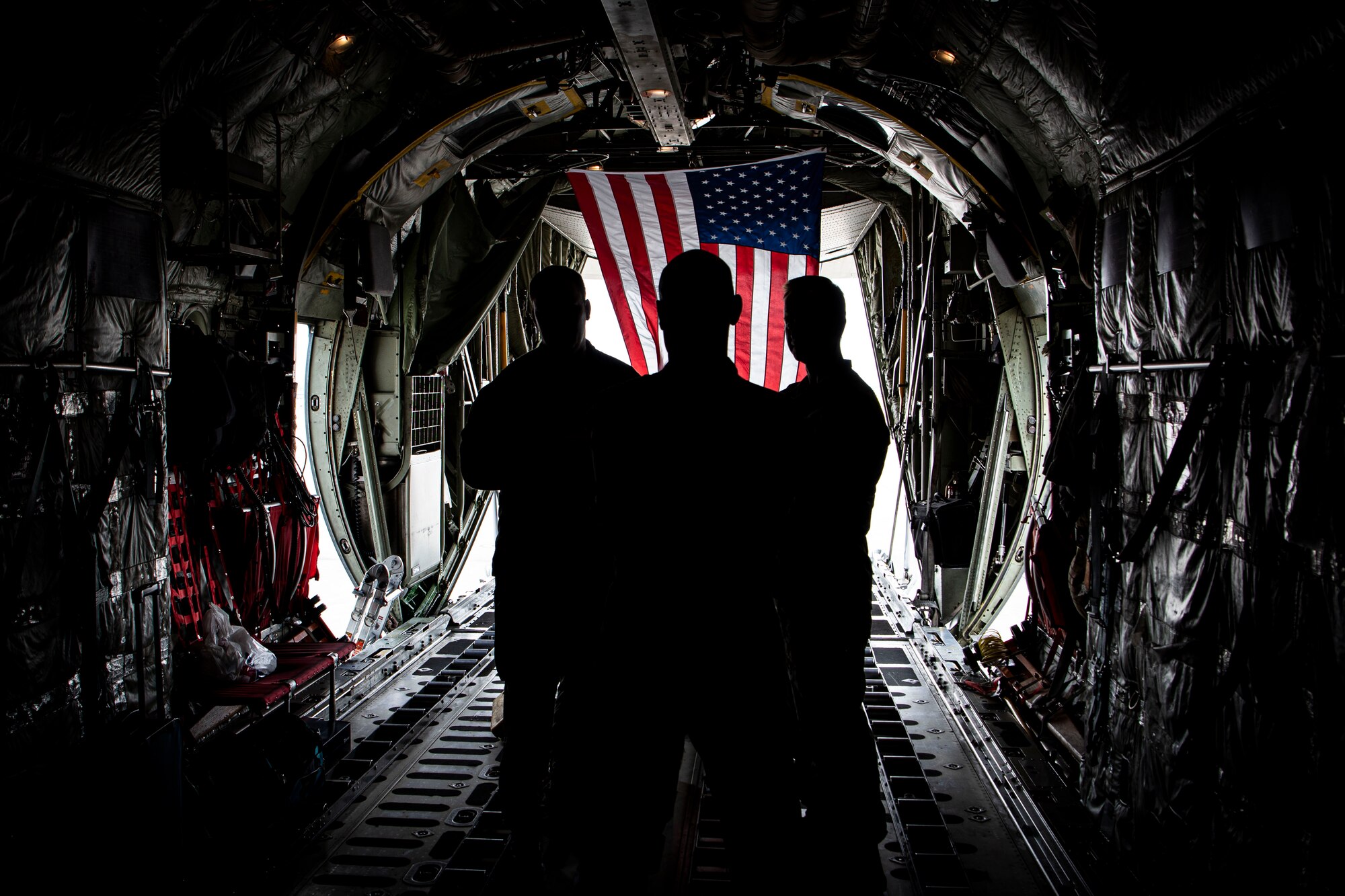 Photo of sailors on a C-130T Hercules.