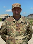 Maj. Andrew Salmo of Herrin, Illinois, the 38th Infantry Division plans officer, at the division's tactical operations center at Camp Atterbury near Edinburgh, Indiana, June 5, 2021. As part of the Army National Guard's aligned-for-training program, Salmo jumped at the opportunity to work at a division level.