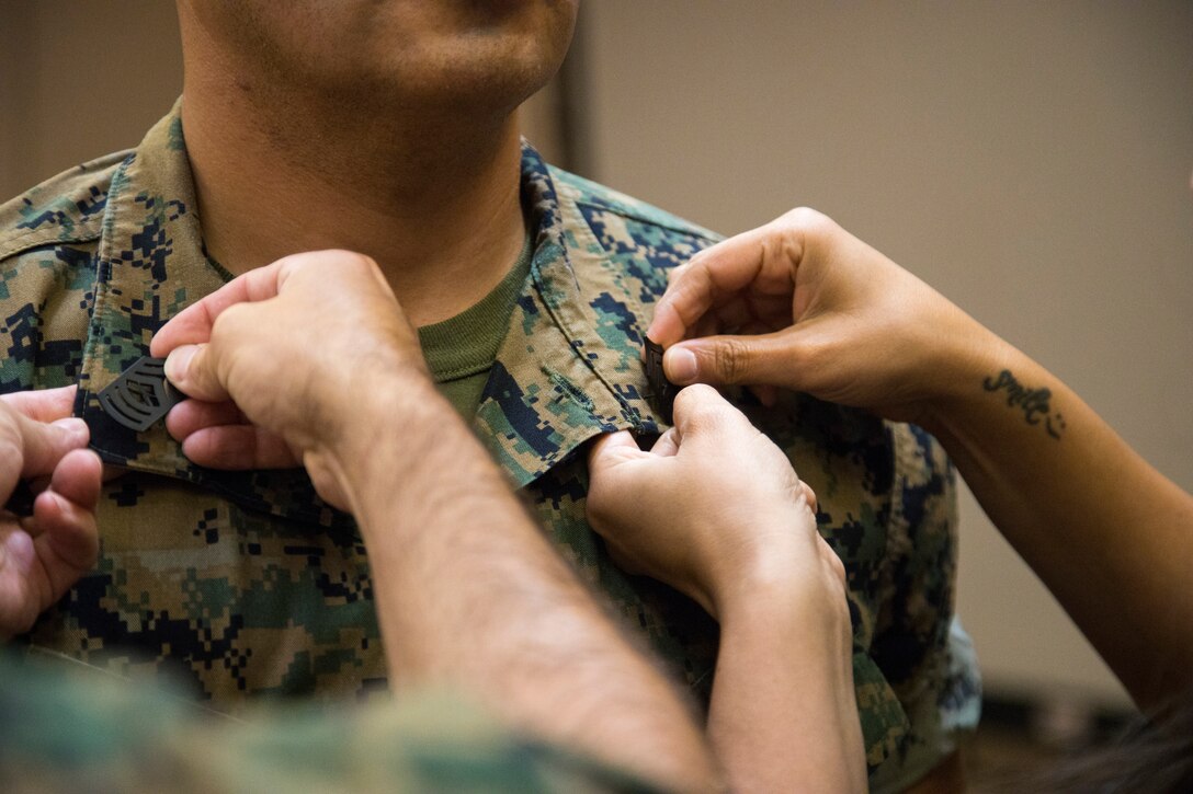 U.S. Marine Corps Master Sgt. James McFaline is pinned during his promotion ceremony on Marine Corps Air Station Yuma, June 4, 2021.