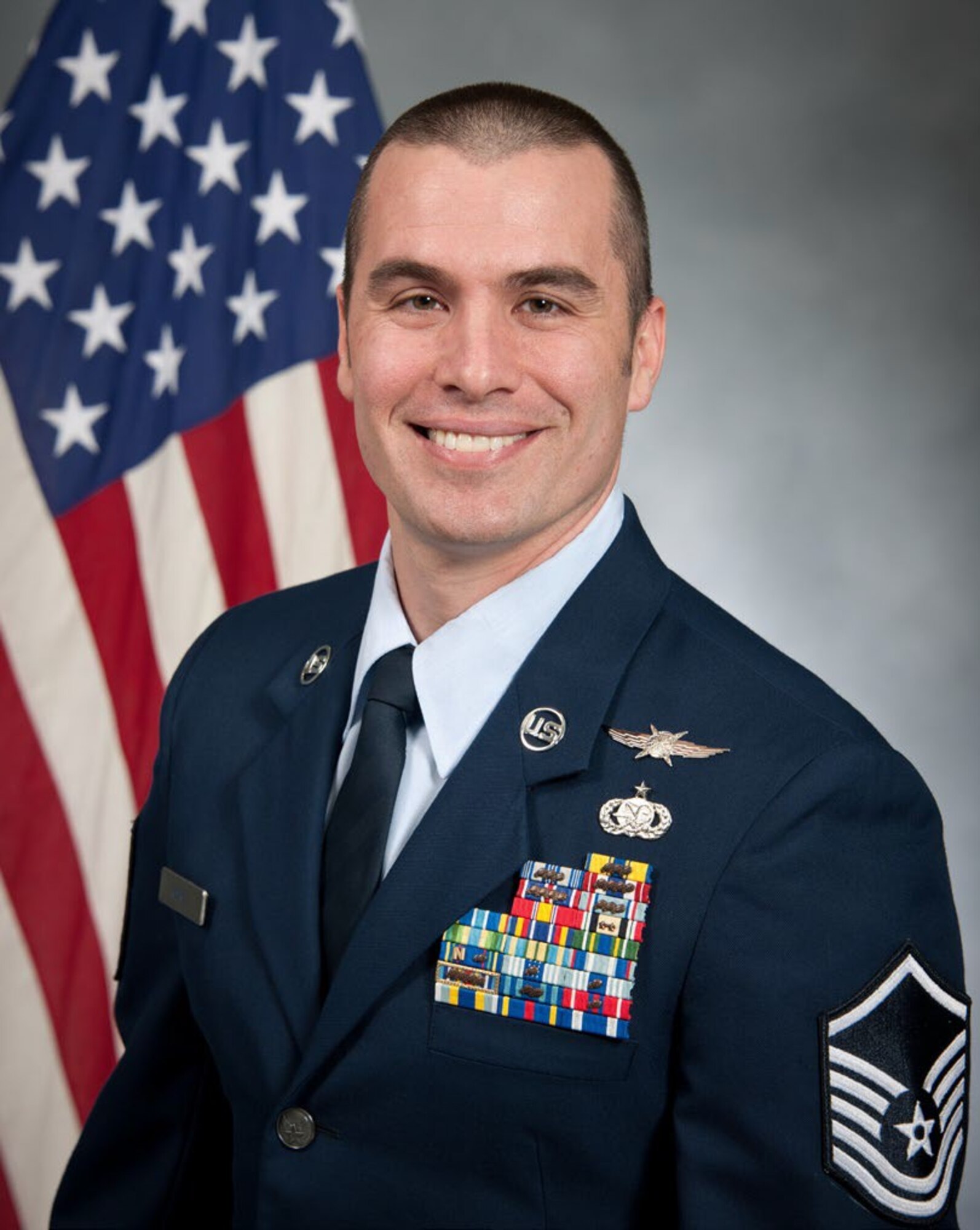 Master Sgt. Michelangelo Serio, 689th Network Operations Squadron defensive cyber operations section chief, has an official photograph taken at Maxwell-Gunter Air Force Base, Alabama, May 11, 2019. (U.S. Air Force courtesy photo)