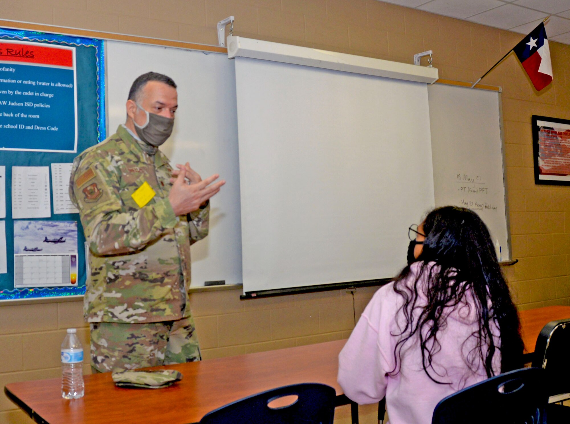 Maj. Eduardo Trelles, 960th Cyberspace Wing intelligence planning branch chief, speaks to a Junior Reserve Officer Training Corps student about becoming a foreign affairs officer at Judson High School, Converse, Texas, May 19, 2021. (U.S. Air Force photo by Samantha Mathison)