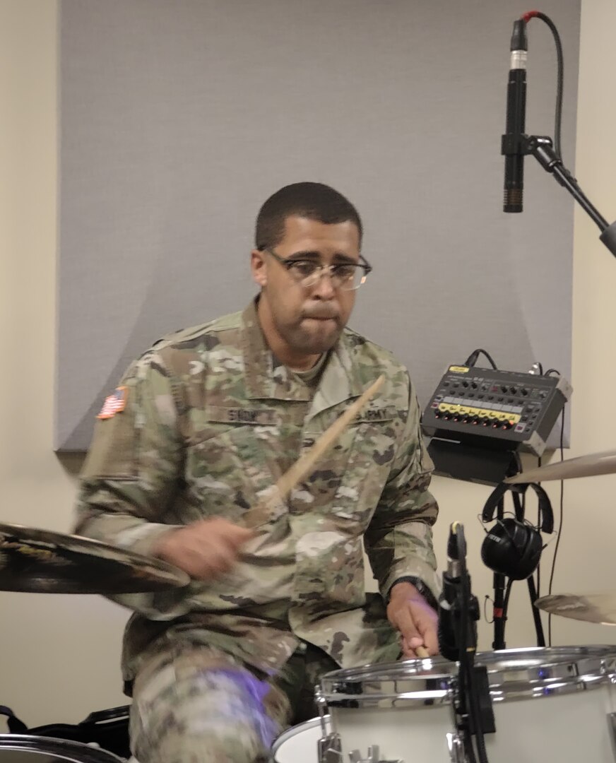 U.S. Army Staff Sgt. Jordan Snow, a musician with the Vermont Army National Guard's 40th Army Band, practices drumming at Camp Johnson, Vermont, June 7, 2021. Snow took part in the State's response to the COVID-19 pandemic. (U.S. Army National Guard photo by Josh Cohen)