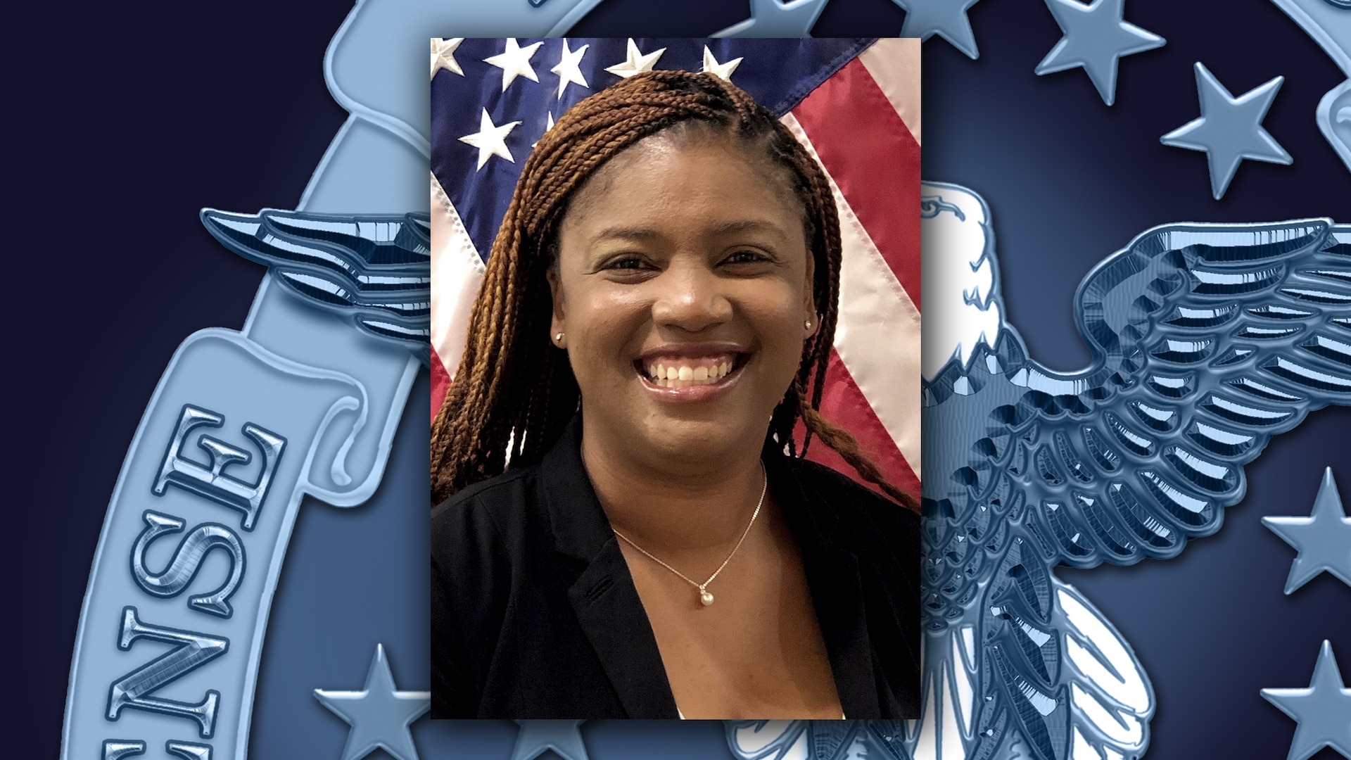 Head and shoulders picture of a Black woman in black shirt in front of the US flag.