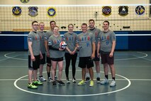 Members of Space Delta 8 – Satellite Communications and Navigational Warfare, 2nd Space Operations Squadron hold a plaque and volleyball to commemorate their victory in the intramural volleyball tournament at the Schriever Fitness Center at Schriever Air Force Base, Colorado on May 20, 2021. Teams did not compete in volleyball in 2020 due to the coronavirus pandemic, however, 2nd SOPS still managed to earn the title in this year’s tournament. (U.S. Space Force photo by Kathryn Damon)