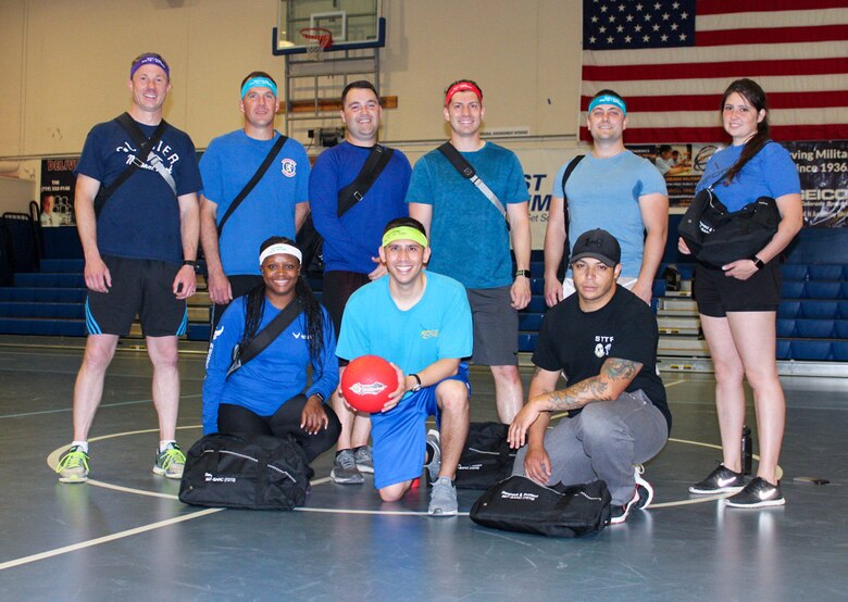 Members of the 379th Space Range Squadron gather at the Schriever Fitness Center after winning a dodgeball tournament hosted by the Schriever Sexual Assault Response and Prevention team on May 27, 2021, at Schriever Air Force Base, Colorado. The SAPR office held the event to raise awareness for the SAPR program. For additional information regarding the SAPR program and resources available, including methods of reporting, local and national assistance phone number and unit classes available by request, visit www.schriever.spaceforce.mil/SAPR. (U.S. Space Force photo by Marcus Hill)