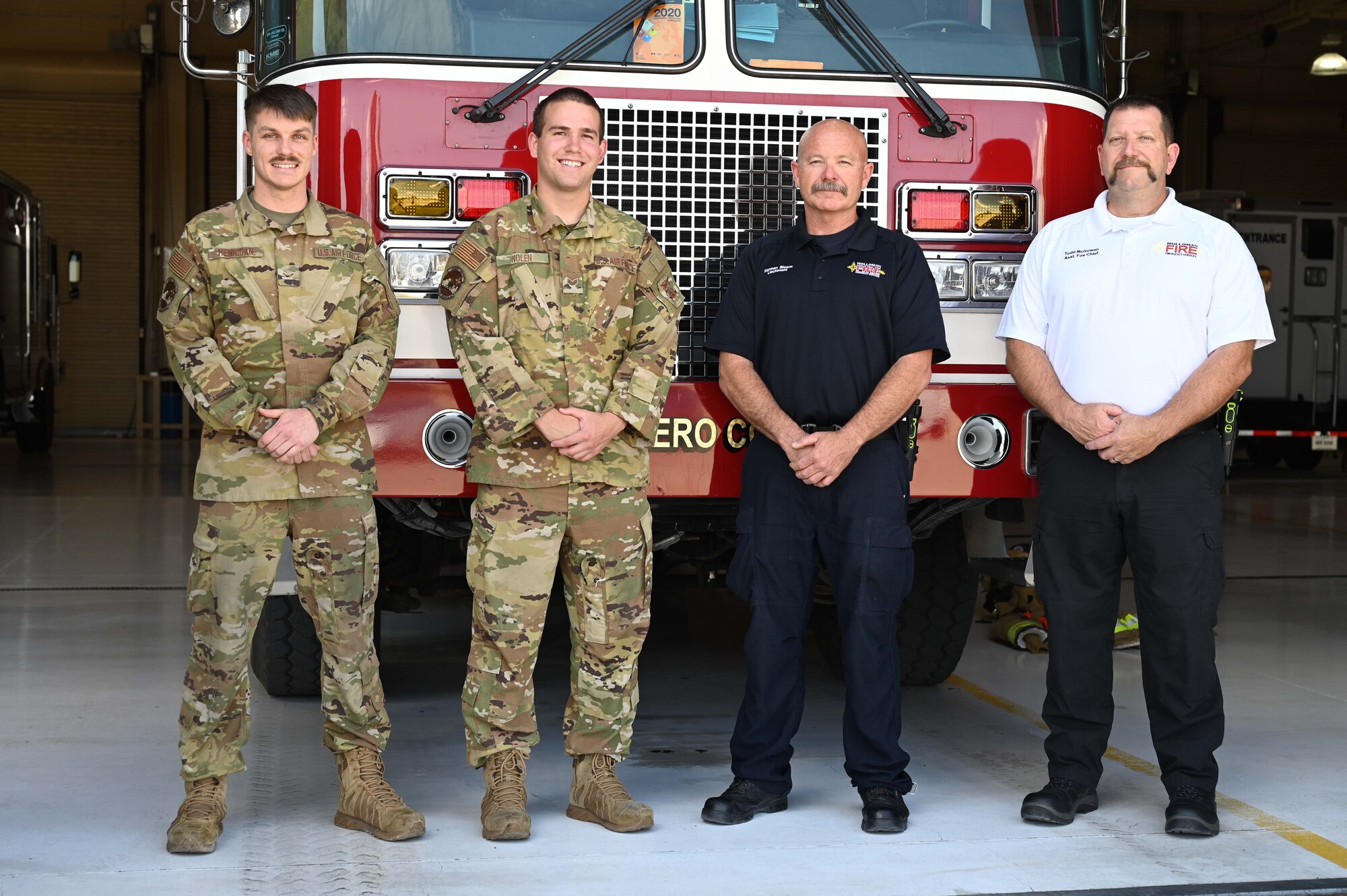 (From left to right) Airman 1st Class Joshua Hennigan, 49th Civil Engineer Squadron firefighter;  Senior Airman Cameron Nolen, 49th CES driver operator; Norman Bloom, 49th CES lead firefighter; and Todd McGowan, 49th CES assistant fire chief, pose for a photo on Holloman Air Force Base New Mexico, June 1, 2021. Hennigan, Nolen, Bloom and McGowan were on the team of first responders that helped deliver the Novotnak’s daughter. (U.S. Air Force Photo by Denise Ottaviano)
