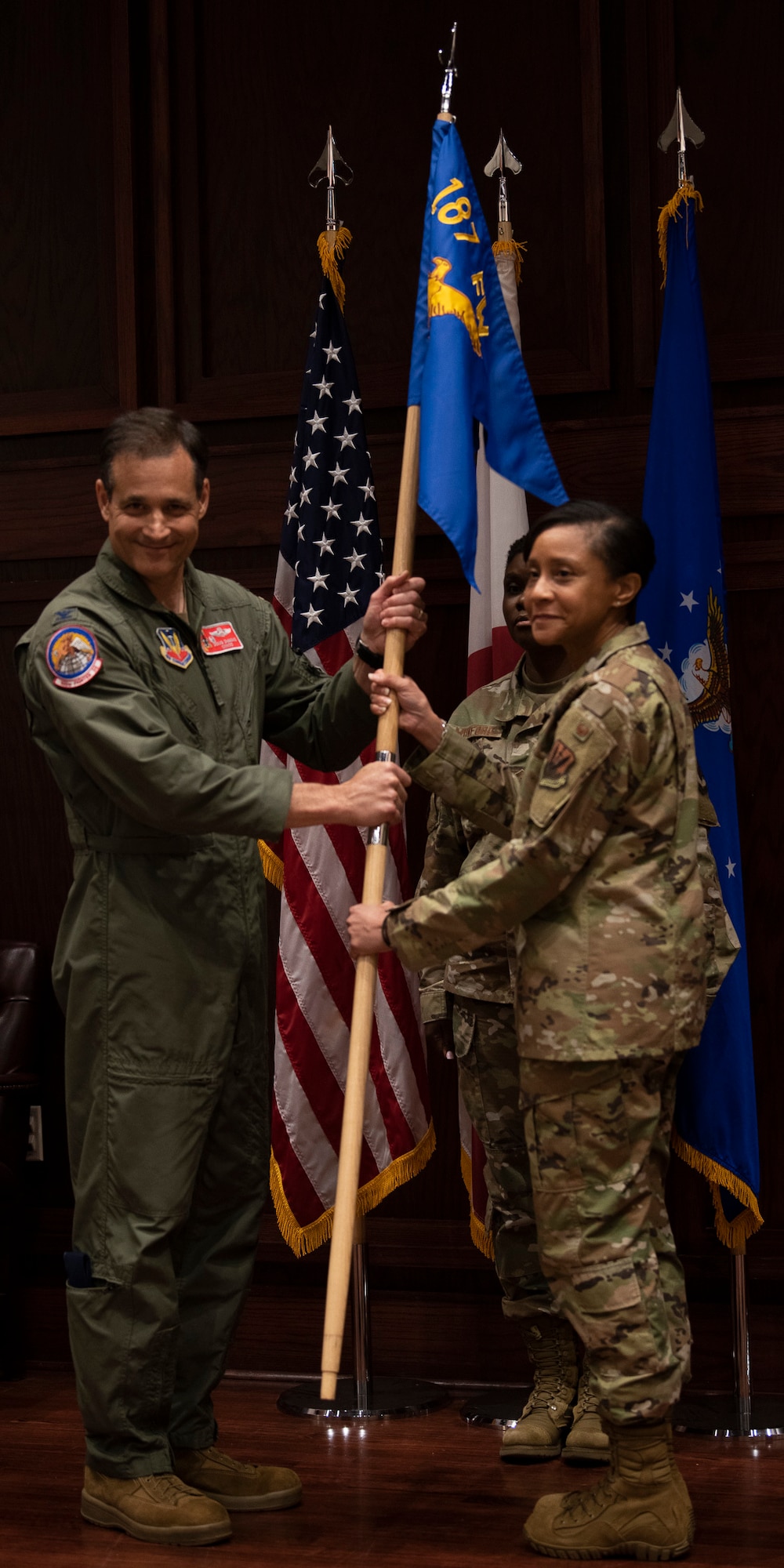 Col. McKennie relinquishes command of the 187th Medical Group during a change of command ceremony.