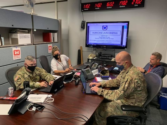 SWG District Commander Tim Vail (left) gets a briefing from  members of the District's Emergency Management team prior to Hurricane Laura in 2020. The SWG Team is prepping for what is expected to be an active 2021 Hurricane Season.