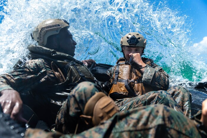 U.S. Marines with India Company, Battalion Landing Team, 3rd Battalion, 5th Marines, 31st Marine Expeditionary Unit, take on crashing waves while riding in the front of a Combat Rubber Raiding Craft during an amphibious raid rehearsal at Kin Blue training area, Okinawa, Japan, May 14, 2021. Marines with the 31st MEU conduct raid rehearsals in order to test operational equipment, sustain proficiency in small boat handling fundamentals and refine standard operating procedures. The 31st MEU, the Marine Corps’ only continuously forward-deployed MEU, provides a flexible and lethal force ready to perform a wide range of military operations as the premier crisis response force in the Indo-Pacific region.