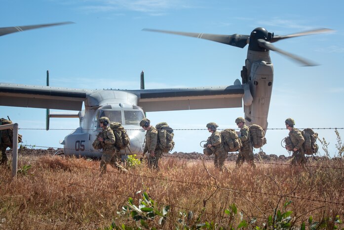Australian Army soldiers carry their gear off a landing zone during exercise Crocodile Response at Point Fawcett, NT, Australia, May 24, 2021. Exercise Crocodile Response tested the ability of MRF-D and the Australian Defence Force to provide disaster relief in the Indo-Pacific region. The rotational deployment of U.S. Marines affords a combined training opportunity with Australia and improves cooperation and integration between the two country’s forces.