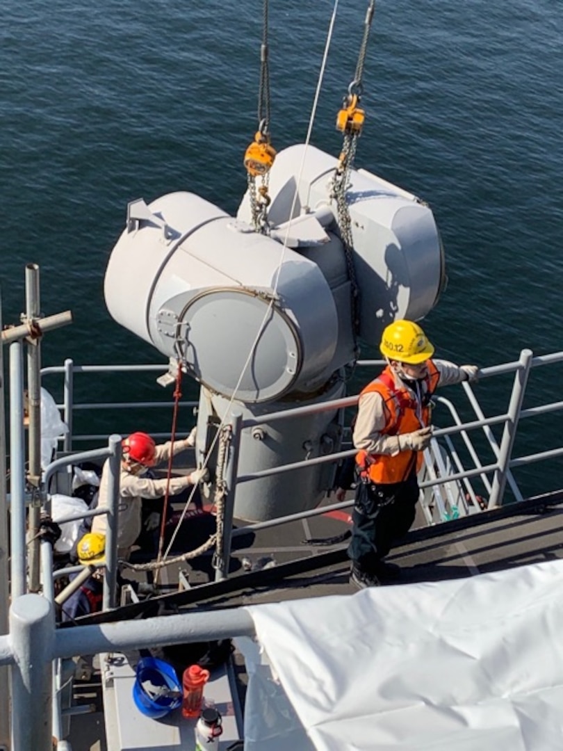 Ship Repair Facility and Japan Regional Maintenance Center’s (SRF-JRMC) production shop personnel work jointly to replace USS Ronald Reagan’s (CVN 76) guided missile directors during her four-month-long selected restricted availability.