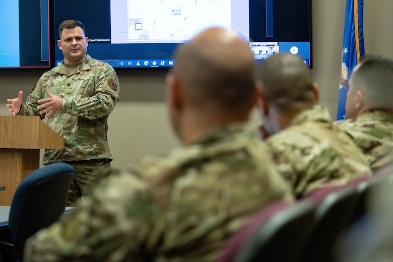 Lieutenant Col. Justin Settles, deputy director, China Aerospace Studies Institute, presents a lecture at the China 'Belt and Road Initiative' training event June 8, 2021, at the Air University Teaching and Learning Center, Maxwell Air Force Base, Alabama.