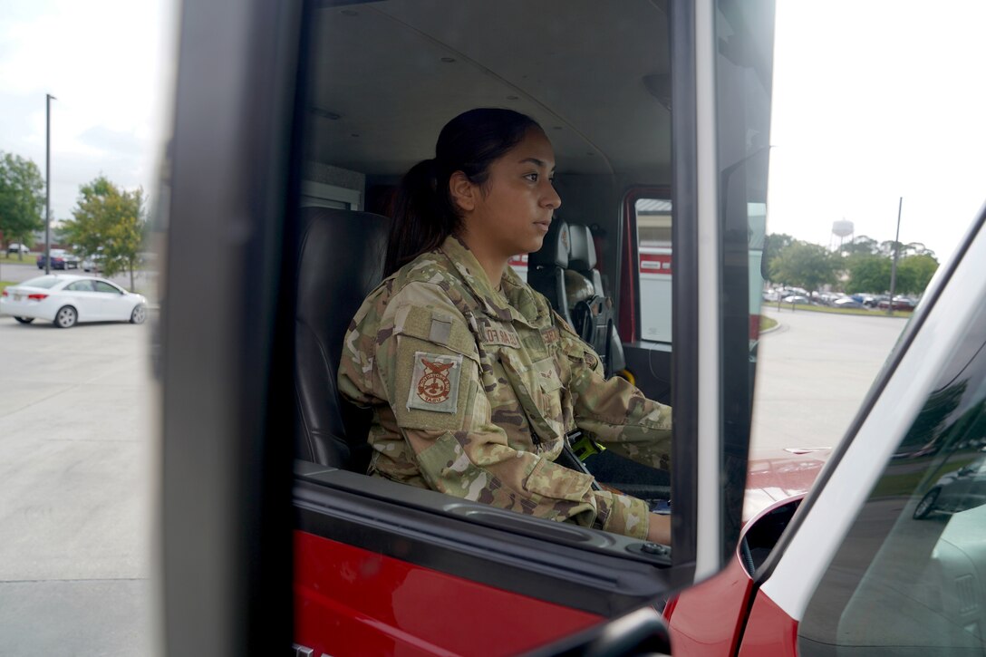 U.S. Air Force Airman 1st Class Cinthia Juarez, 81st Civil Engineer Squadron driver operator, operates a fire truck outside the fire station at Keesler Air Force Base, Mississippi, June 2, 2021. The Keesler Fire Department responds to medical emergencies on and around base 24 hours a day. (U.S. Air Force photo by Senior Airman Seth Haddix)